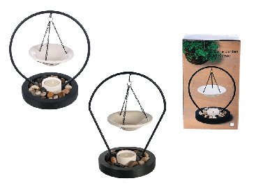 Ceramic bowl hanging on metal stand on black wooden bowl with deco stones & tealight